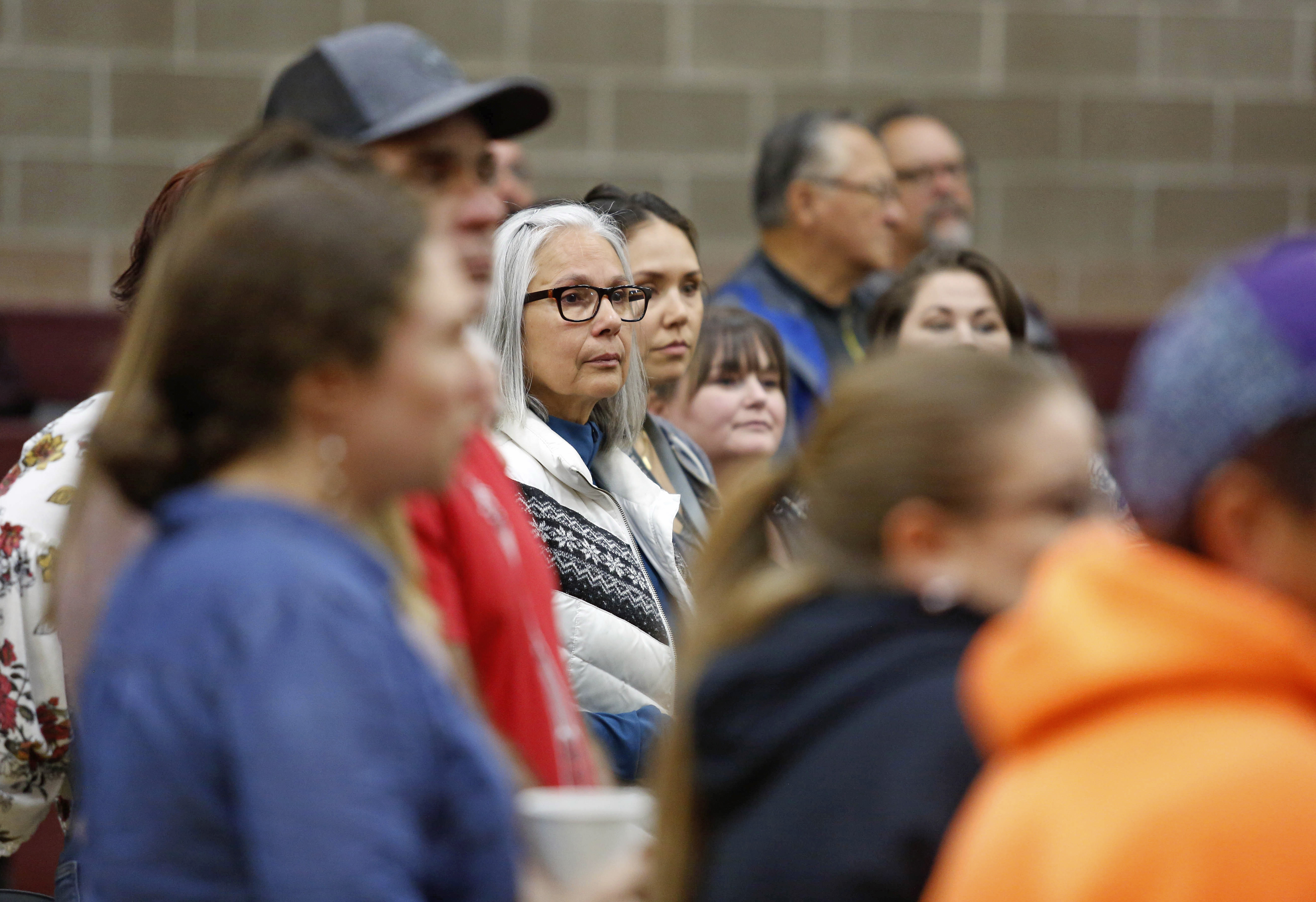 Vocational Rehabilitation Caseworker Carmen Mercier, center, joins other Tribal members on the first day of the second annual Gathering of Grand Ronde Tilixam held in the Tribal gym on Tuesday, May. 21. The event was to bring the community together for healing, to learn from the historical trauma that continues to affect the community and to learn new skills to help restore balance. (Photo by Timothy J. Gonzalez/Smoke Signals)